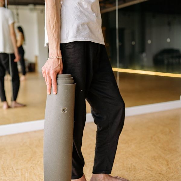 Man holding a plank yoga pose, demonstrating core strength.